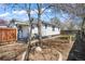 Backyard featuring a well-maintained lawn and an attractive landscape around the home at 45 S Grove St, Denver, CO 80219
