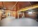 Spacious unfinished basement with painted floors and paneled walls, ready for new owner's creativity at 45 S Grove St, Denver, CO 80219