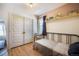 Cozy bedroom with twin bed, large closet, hardwood floors and neutral decor at 45 S Grove St, Denver, CO 80219