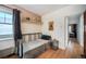 Bedroom showcasing bed, hardwood floors, window and doorway to another room at 45 S Grove St, Denver, CO 80219