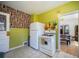 Kitchen view with refrigerator, stove, and doorway to dining room at 45 S Grove St, Denver, CO 80219