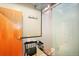 Modern bathroom featuring a glass-enclosed shower, a bench, a wood door, and subway tile at 2000 Little Raven St # 1B, Denver, CO 80202