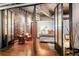 Bedroom opening up to sitting area, natural light and hardwood floors at 2000 Little Raven St # 1B, Denver, CO 80202