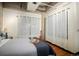 Bedroom with warm lighting and a view of outside through the curtains at 2000 Little Raven St # 1B, Denver, CO 80202