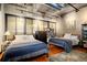 Comfortable bedroom showcasing two beds and ample natural light at 2000 Little Raven St # 1B, Denver, CO 80202