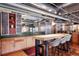 Bright kitchen featuring an island with bar stool seating, stainless steel appliances, and modern countertops at 2000 Little Raven St # 1B, Denver, CO 80202