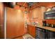 Bright eat-in kitchen with custom cabinets, stainless appliances, and hardwood floors at 2000 Little Raven St # 1B, Denver, CO 80202
