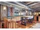 Open concept kitchen featuring bar seating, stainless steel appliances, and exposed ductwork at 2000 Little Raven St # 1B, Denver, CO 80202