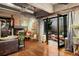 Inviting living room features hardwood floors, fireplace, and access to the outdoor patio area at 2000 Little Raven St # 1B, Denver, CO 80202