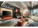 Spacious living room featuring a fireplace, exposed ductwork, and stylish decor at 2000 Little Raven St # 1B, Denver, CO 80202