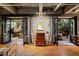 Bright living room with hardwood floors and patio doors showcasing the outdoor living space at 2000 Little Raven St # 1B, Denver, CO 80202