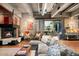 Living room with a fireplace, comfortable seating, and view to the back outdoor living area at 2000 Little Raven St # 1B, Denver, CO 80202