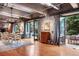 Open floor plan featuring dining area, sitting area, and outdoor patio space with exposed ductwork at 2000 Little Raven St # 1B, Denver, CO 80202