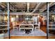Open living area with hardwood floors, exposed ductwork, and comfortable seating at 2000 Little Raven St # 1B, Denver, CO 80202
