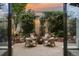 Beautiful patio features lovely plants and string lights, and comfortable seating around a fire pit at 2000 Little Raven St # 1B, Denver, CO 80202