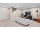 Finished basement area with cozy seating, providing a versatile space for entertainment and relaxation at 7746 E Severn Pl, Denver, CO 80230