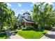 Beautiful two-story home with well-manicured lawn and mature trees, offering a serene setting at 7746 E Severn Pl, Denver, CO 80230