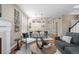Spacious living room showcasing a fireplace, dining area, and comfortable seating for entertaining guests at 7746 E Severn Pl, Denver, CO 80230