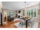 Bright and airy living space showcasing an open floor plan with a fireplace, dining area, and comfortable seating at 7746 E Severn Pl, Denver, CO 80230