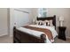 Cozy bedroom showcasing a large bed, neutral decor, and a serene atmosphere at 7746 E Severn Pl, Denver, CO 80230