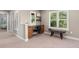 Office space with custom cabinetry, a comfortable chair, and plenty of natural light from the windows at 7746 E Severn Pl, Denver, CO 80230