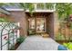 Cozy back patio area with charming seating and lush greenery, perfect for outdoor relaxation and entertaining at 7746 E Severn Pl, Denver, CO 80230