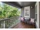 Charming porch area with seating, offering a peaceful outdoor retreat amidst lush greenery at 7746 E Severn Pl, Denver, CO 80230