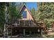 Charming A-frame home with a wood deck and wooded views at 100 Aspen Ln, Evergreen, CO 80439