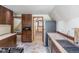 Well-lit kitchen with granite countertops and stainless steel appliances, adjacent to a bedroom at 100 Aspen Ln, Evergreen, CO 80439