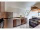 Compact kitchen with granite counters, stainless steel appliances, and a window framing natural light at 100 Aspen Ln, Evergreen, CO 80439
