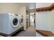 Laundry room with washer and dryer next to the hallway at 100 Aspen Ln, Evergreen, CO 80439