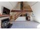 An open-concept living room showcasing a fireplace, lofted space, and stairs to the upper level at 100 Aspen Ln, Evergreen, CO 80439
