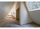 A-frame loft featuring carpet and a skylight at 100 Aspen Ln, Evergreen, CO 80439