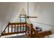 A-frame loft featuring wood railing, carpet and a ceiling fan at 100 Aspen Ln, Evergreen, CO 80439