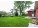 Backyard with a lush lawn and mature trees at 3222 Fenton St, Wheat Ridge, CO 80212