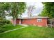 Backyard with a lush lawn and mature trees at 3222 Fenton St, Wheat Ridge, CO 80212