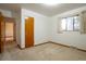 Bedroom with a window and neutral carpet at 3222 Fenton St, Wheat Ridge, CO 80212