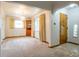 Dining area featuring a decorative chandelier, built-in shelving, and neutral carpet at 3222 Fenton St, Wheat Ridge, CO 80212