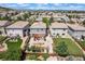 An aerial view showing the backyard landscaping, patio, and proximity to neighboring homes at 2320 Morningview Ln, Castle Rock, CO 80109