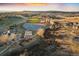 A beautiful aerial view of the neighborhood park featuring a playground, baseball field, and green spaces at 2320 Morningview Ln, Castle Rock, CO 80109