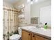 Comfortable bathroom with a shower and palm tree-themed curtain at 2320 Morningview Ln, Castle Rock, CO 80109