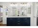 Elegant bathroom featuring marble countertops, dual sinks, and modern fixtures at 2320 Morningview Ln, Castle Rock, CO 80109