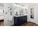 Bathroom with double sinks and modern cabinetry at 2320 Morningview Ln, Castle Rock, CO 80109