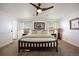 Spacious bedroom with a ceiling fan, allowing for a comfortable and relaxing environment at 2320 Morningview Ln, Castle Rock, CO 80109