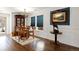 Inviting dining room features hardwood floors, an elegant chandelier, and ample natural light at 2320 Morningview Ln, Castle Rock, CO 80109