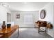Spacious upper level landing featuring stylish wood furniture, neutral colors, and lots of natural light at 2320 Morningview Ln, Castle Rock, CO 80109