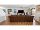 Spacious living room with hardwood floors and a large leather sofa for ample seating at 2320 Morningview Ln, Castle Rock, CO 80109