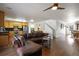 Spacious living room with wood floors and modern ceiling fan at 2320 Morningview Ln, Castle Rock, CO 80109