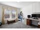 Bright office features large windows, custom built-in desk, and ample storage for a productive workspace at 2320 Morningview Ln, Castle Rock, CO 80109