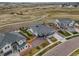 An aerial view shows a well-maintained, modern home situated on a spacious lot in a landscaped neighborhood at 14341 Beebalm Loop, Parker, CO 80134